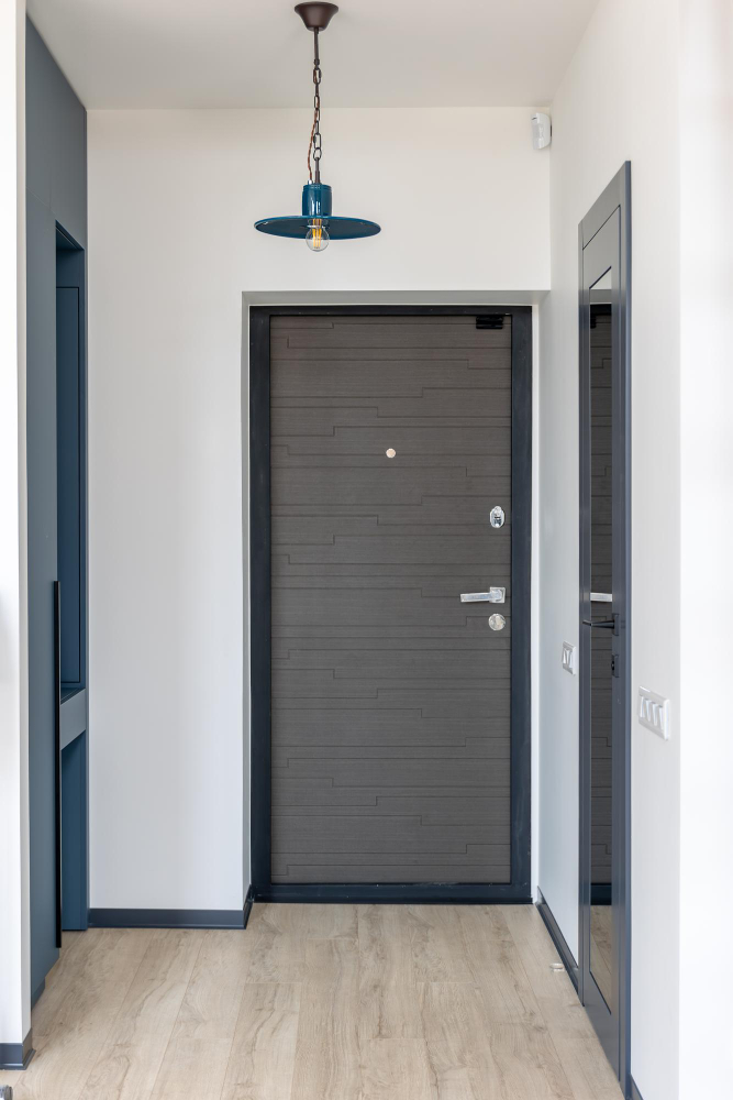 Classic white interior double door with brass handles
