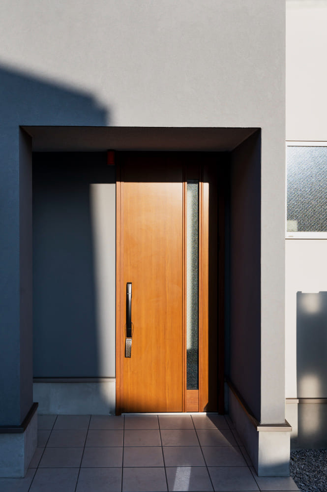 Carved wooden double entry doors with glass panels